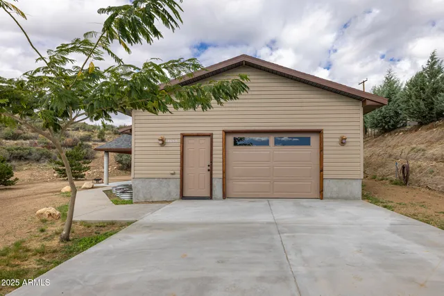 a front view of a house with a garage