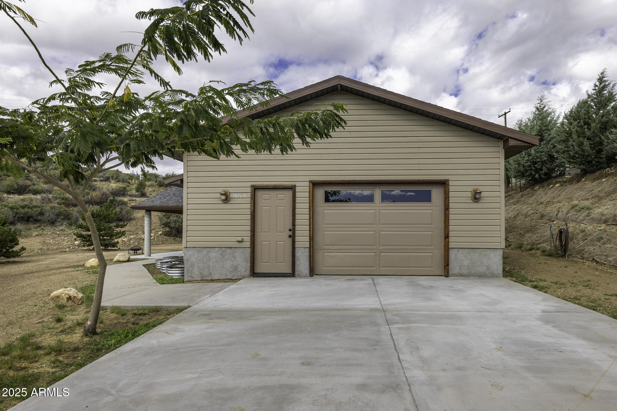 a front view of a house with a garage