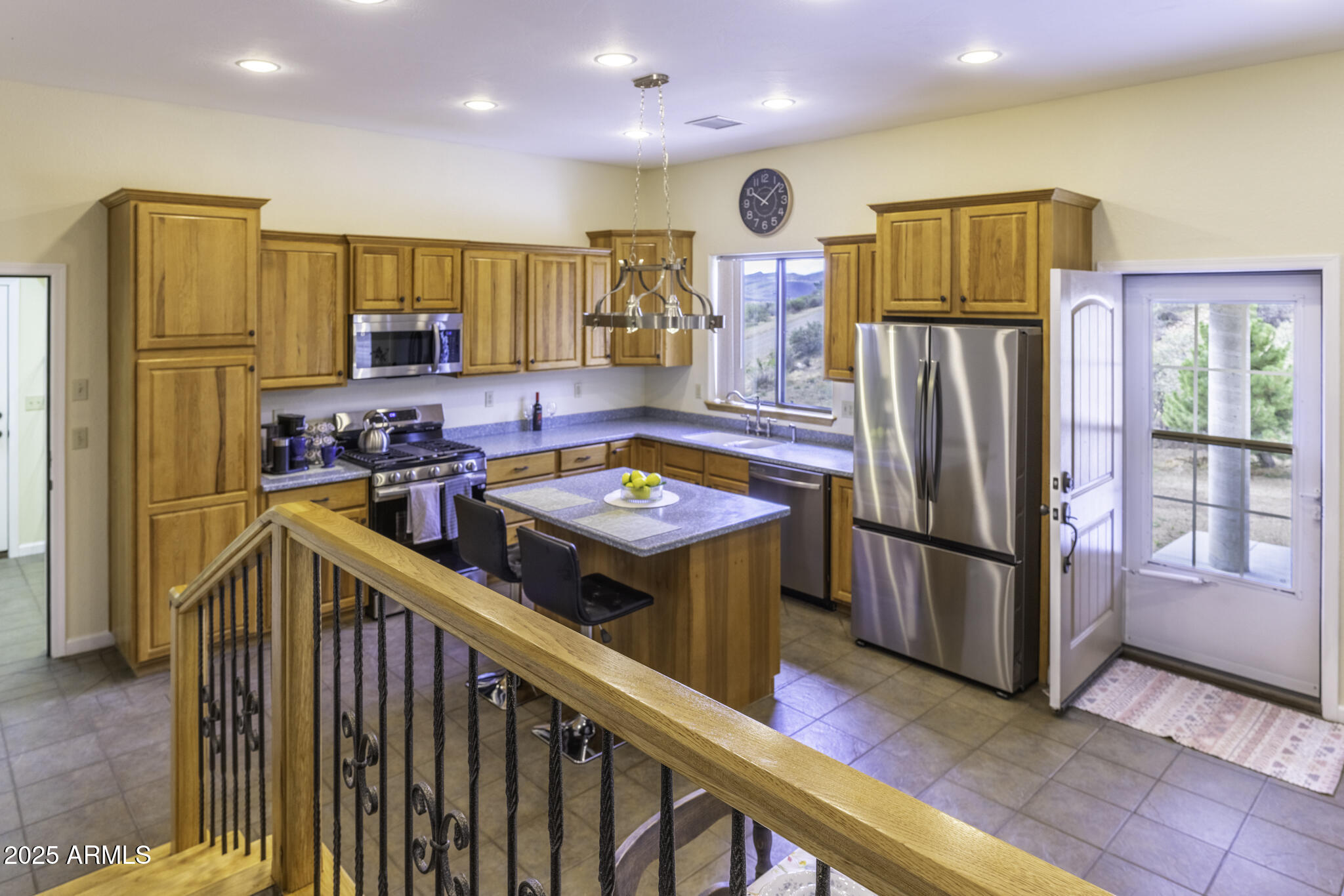 18168 Spoon Road Peeples Valley, AZ 86332 - Photo 11 of 32 a kitchen with stainless steel appliances granite countertop a refrigerator a stove a sink and a refrigerator