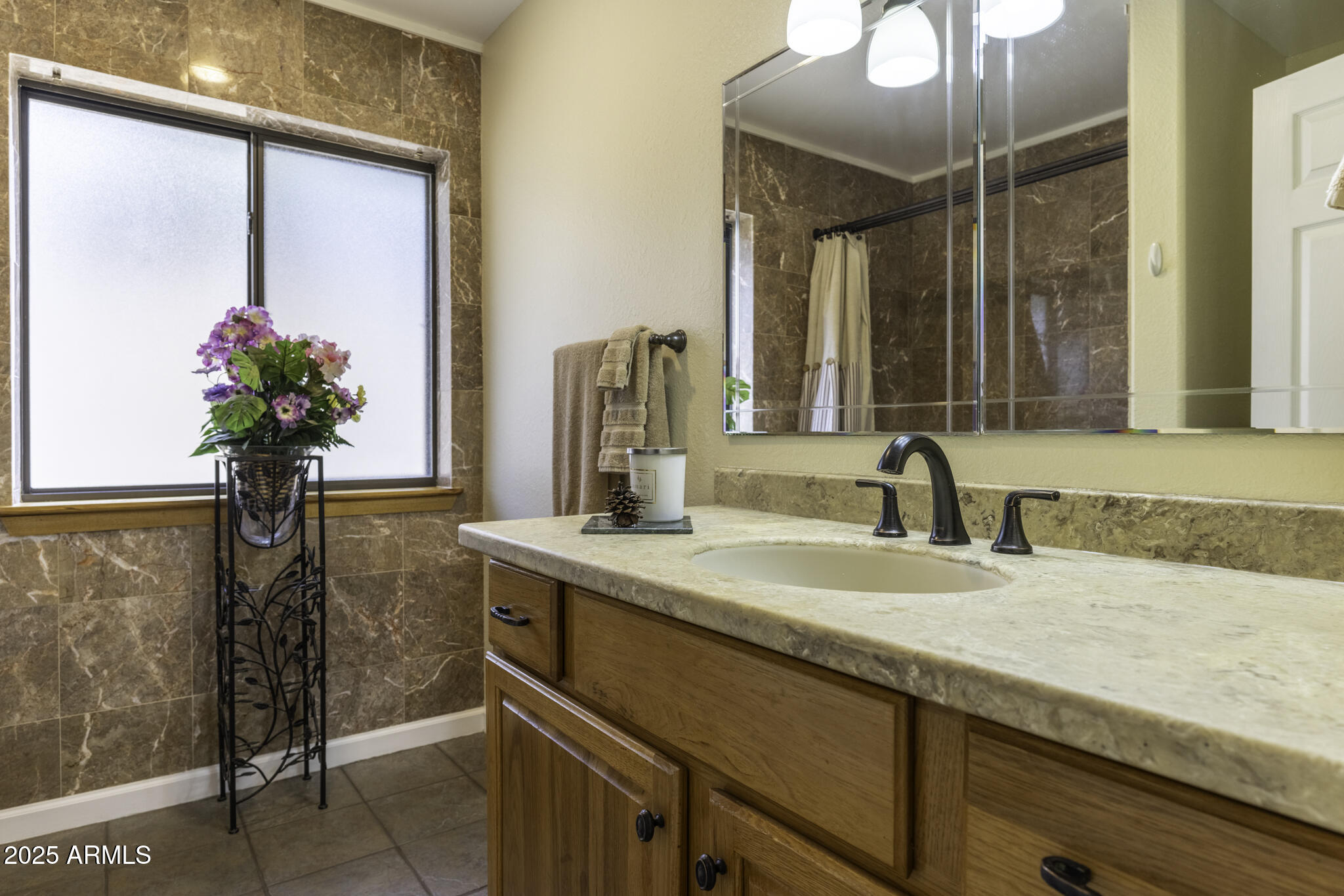 18168 Spoon Road Peeples Valley, AZ 86332 - Photo 13 of 32 a bathroom with a granite countertop sink and a mirror