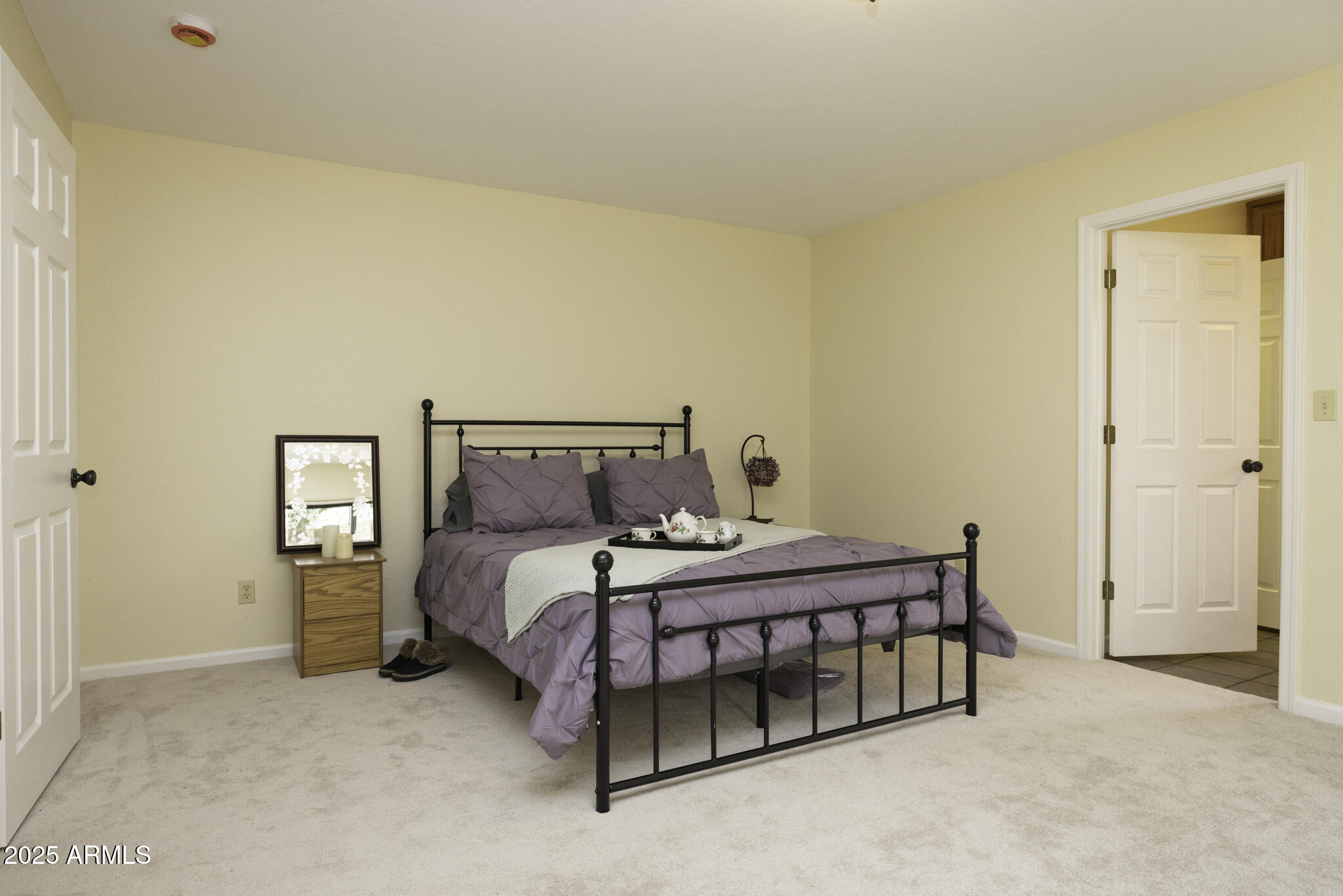 18168 Spoon Road Peeples Valley, AZ 86332 - Photo 15 of 32 a bedroom with a bed and a window