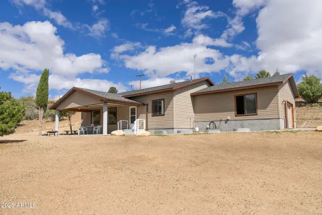a front view of a house with a yard and street view