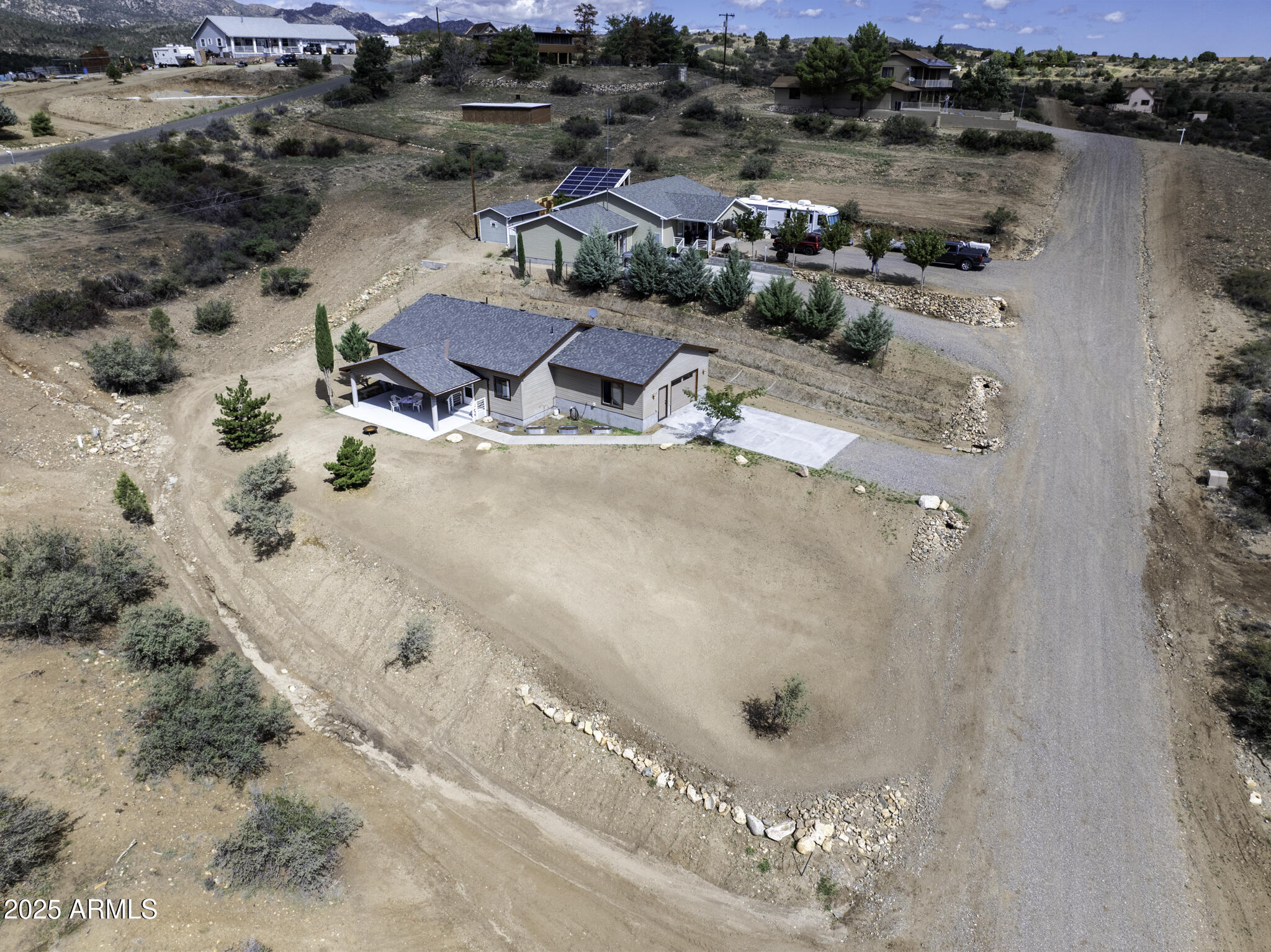 18168 Spoon Road Peeples Valley, AZ 86332 - Photo 28 of 32 an aerial view of a house with a yard and ocean view