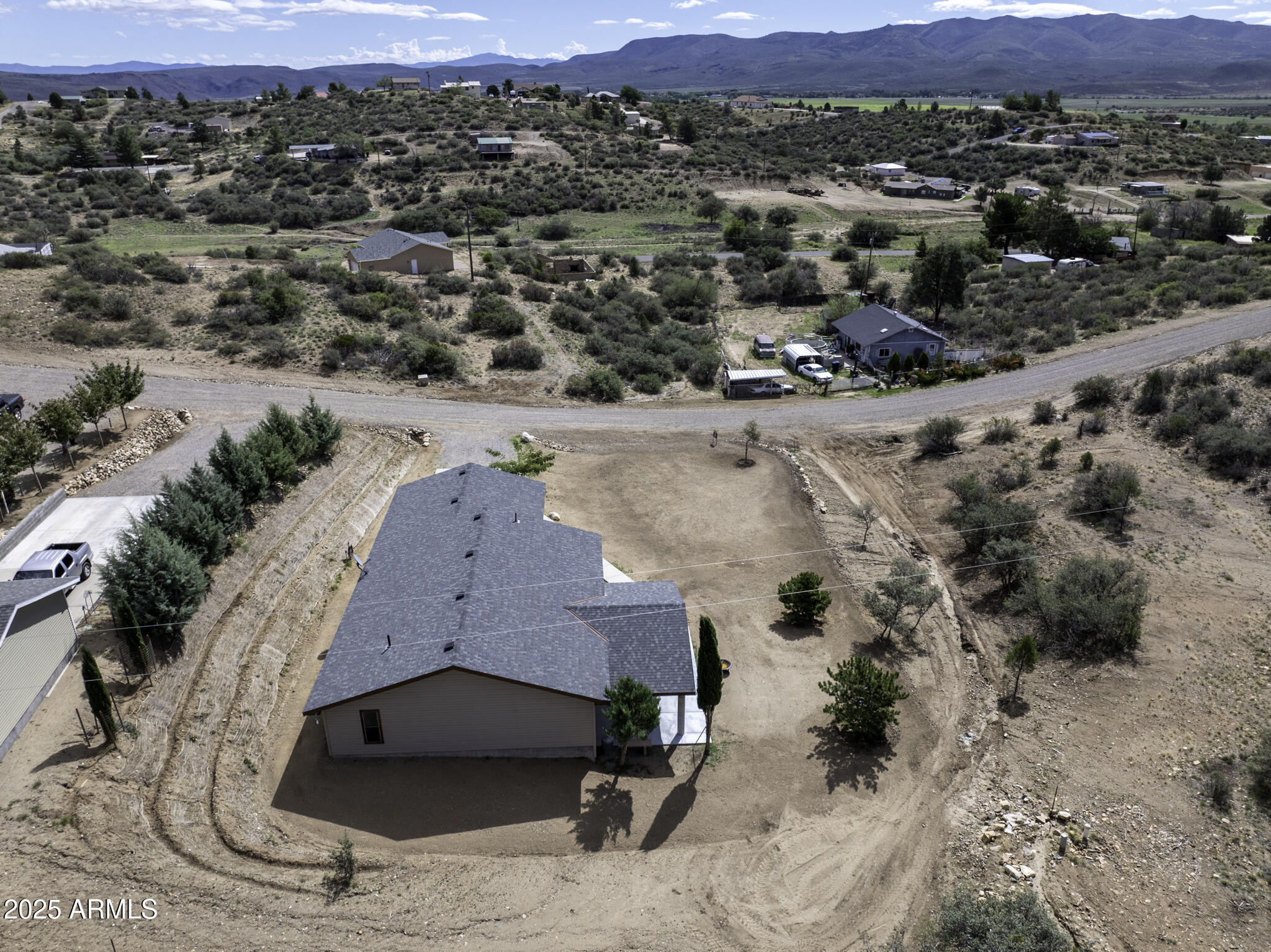 18168 Spoon Road Peeples Valley, AZ 86332 - Photo 30 of 32 an aerial view of a house with a yard