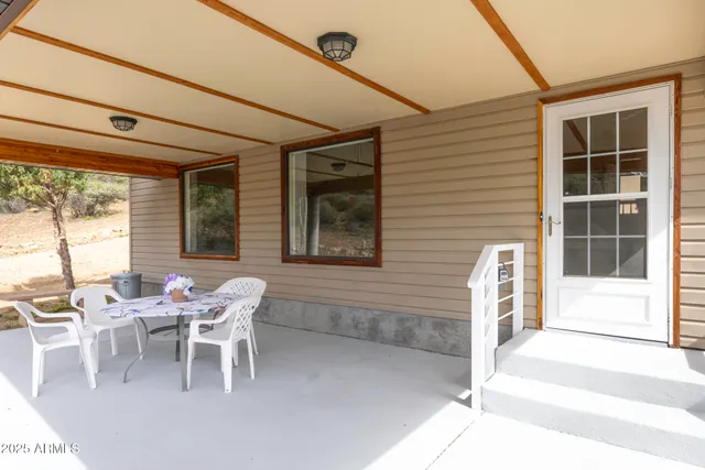 a dining room with furniture and windows