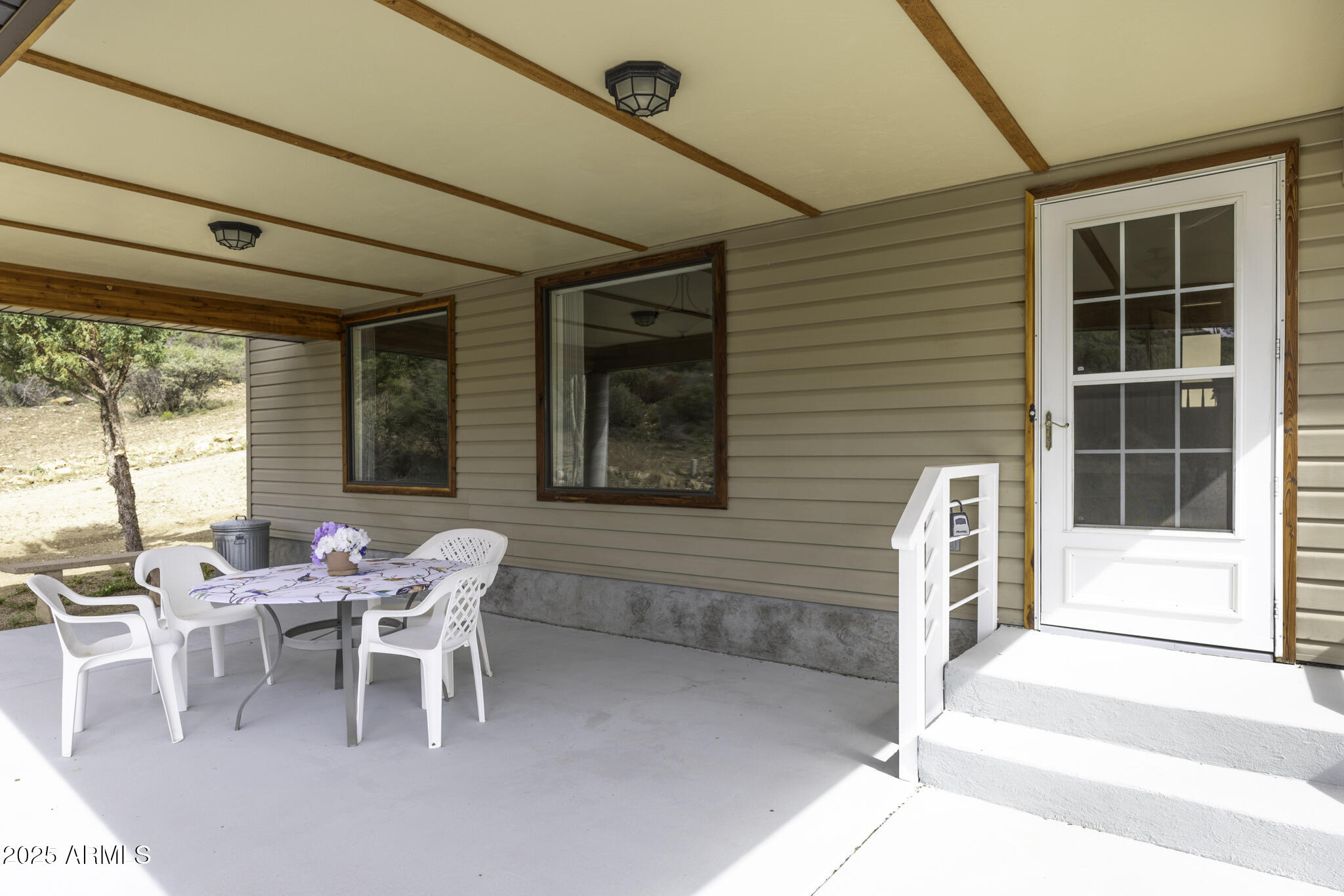 18168 Spoon Road Peeples Valley, AZ 86332 - Photo 3 of 32 a dining room with furniture and windows