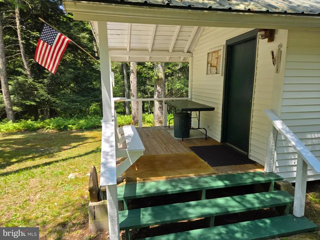 a kitchen with refrigerator and window