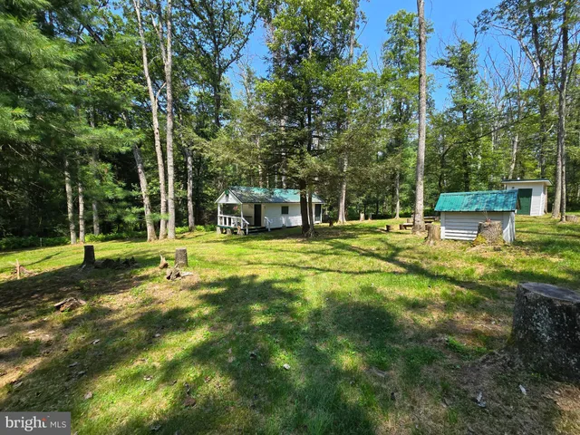 a view of a house with a big yard