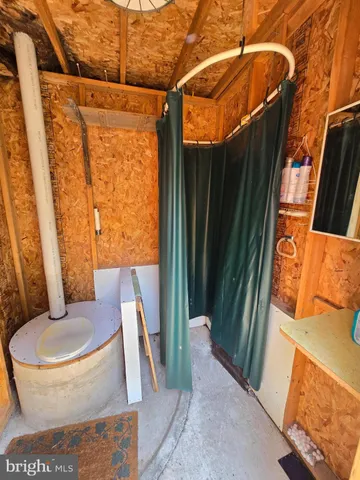 a bathroom with a toilet and shower