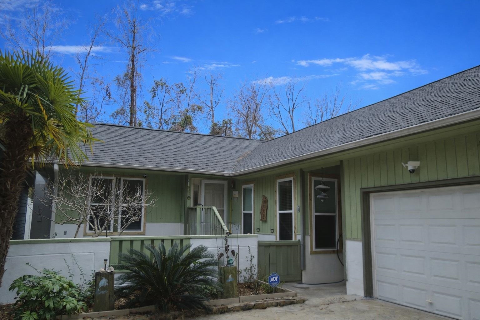 815 Willow Trace Myrtle Beach, SC 29572 - Photo 1 of 20 Entrance to property featuring a shingled roof and a garage