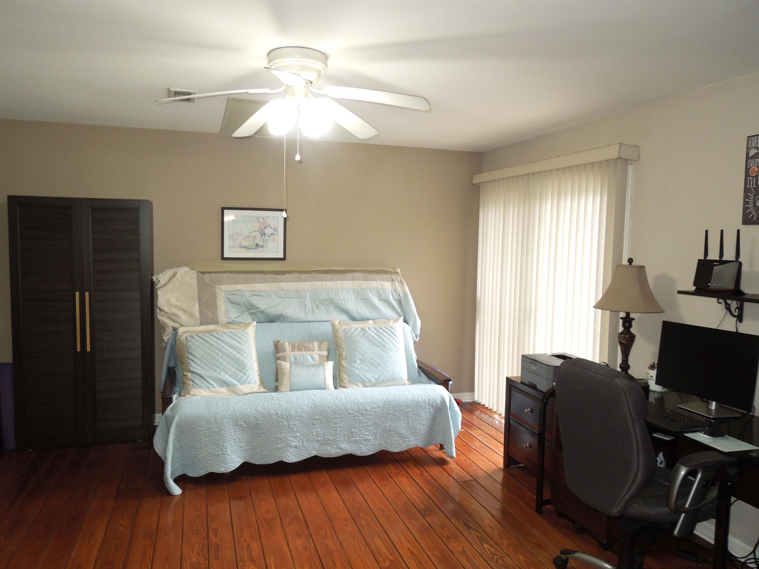 815 Willow Trace Myrtle Beach, SC 29572 - Photo 5 of 20 Bedroom featuring wood-type flooring, an office area, and ceiling fan