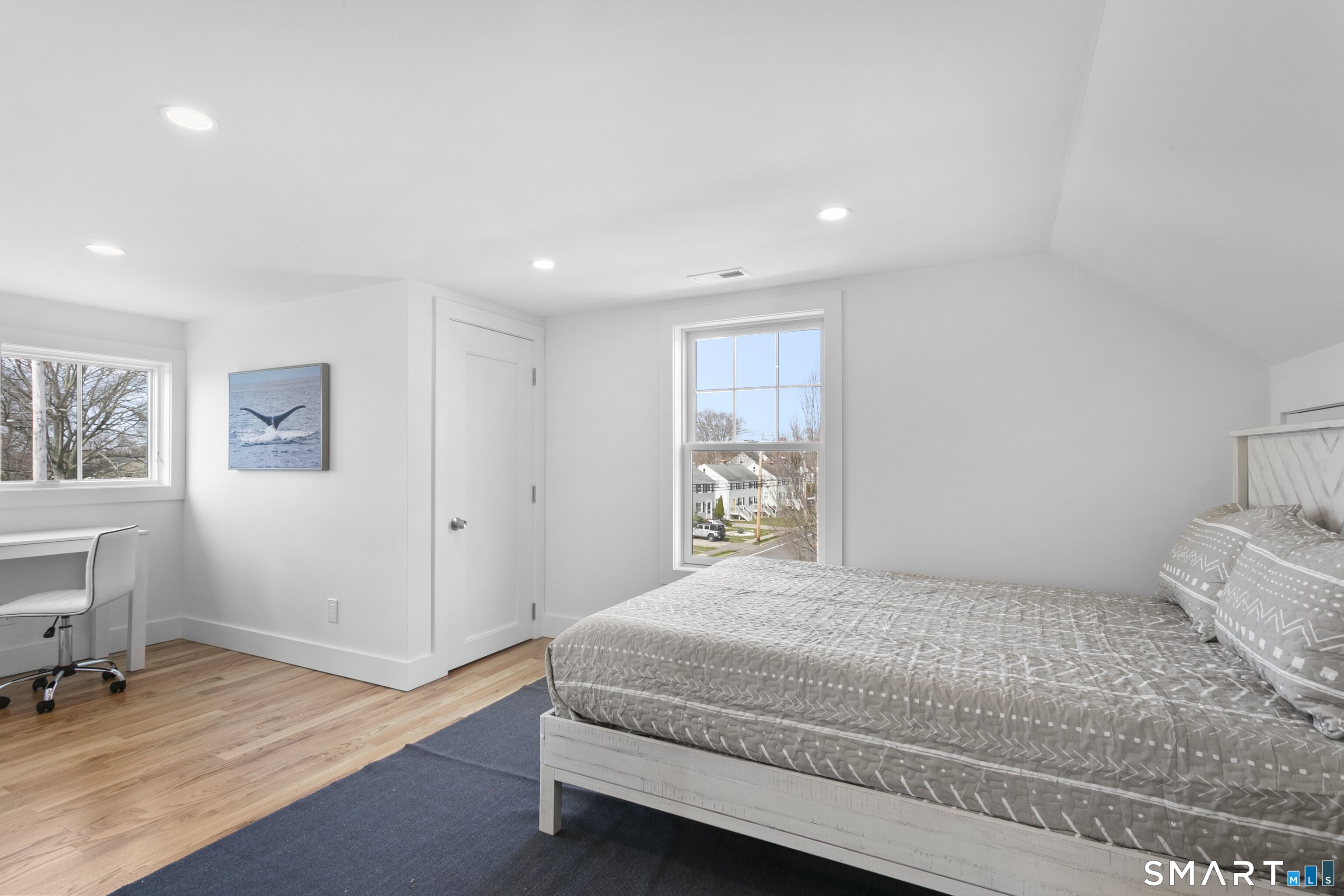 12 Sandy Way Fairfield, CT 06824 - Photo 26 of 33 a spacious bedroom with a bed and a table in it