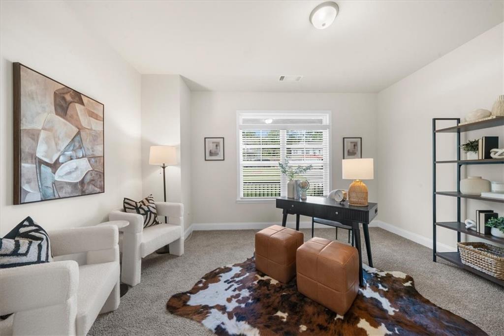 8620 Standing Stone Ball Ground, GA 30107 - Photo 22 of 61 a living room with furniture and a large window