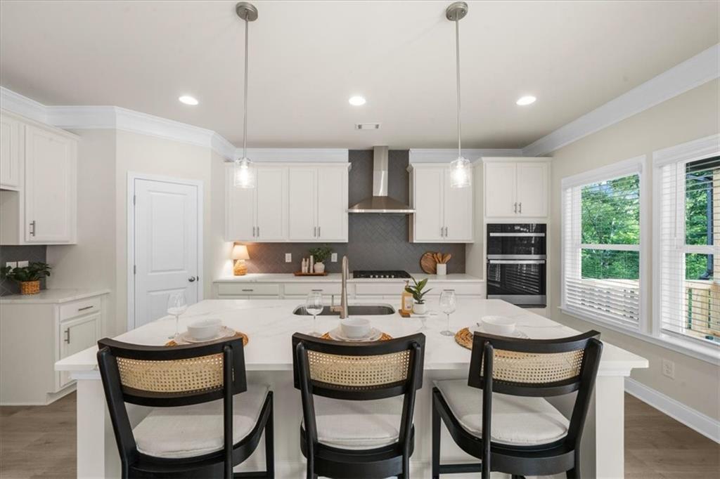 8620 Standing Stone Ball Ground, GA 30107 - Photo 26 of 61 a dining room with furniture a large window and kitchen view