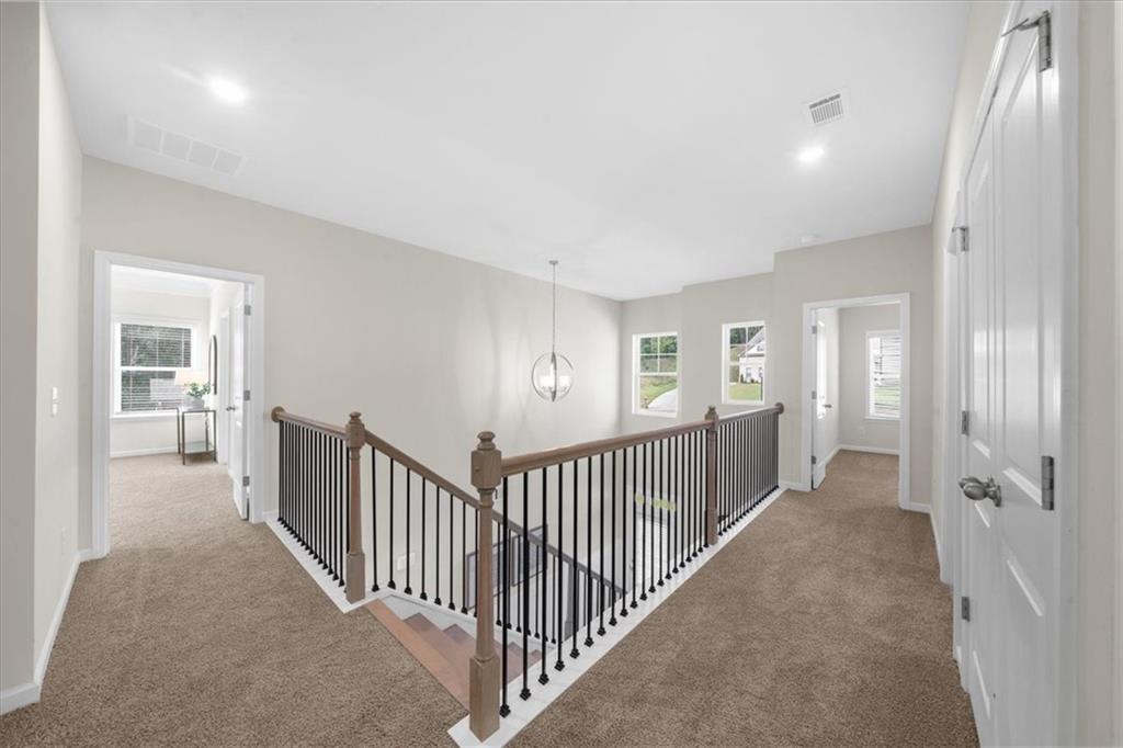 8620 Standing Stone Ball Ground, GA 30107 - Photo 32 of 61 a view of a hallway with a livingroom and stairs