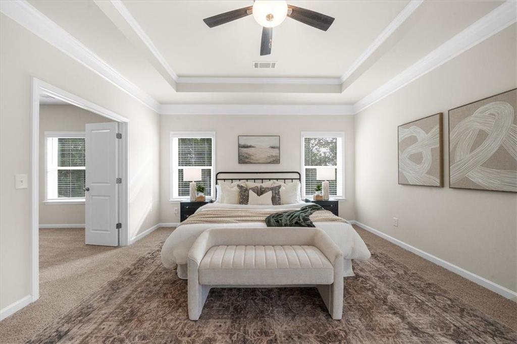 8620 Standing Stone Ball Ground, GA 30107 - Photo 33 of 61 a bedroom with a large bed and a chandelier