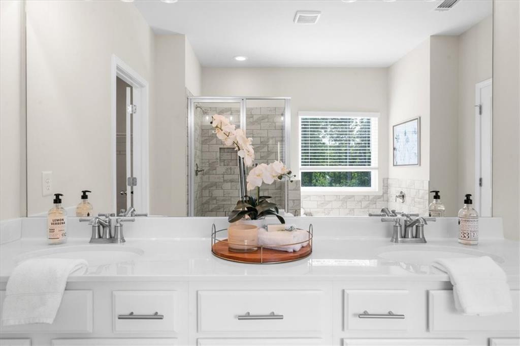 8620 Standing Stone Ball Ground, GA 30107 - Photo 36 of 61 a bathroom with sink double vanity and a mirror