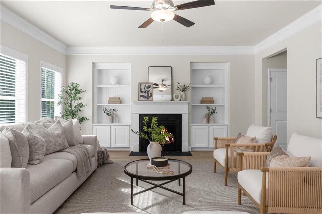 8620 Standing Stone Ball Ground, GA 30107 - Photo 4 of 61 a living room with furniture a fireplace and a window