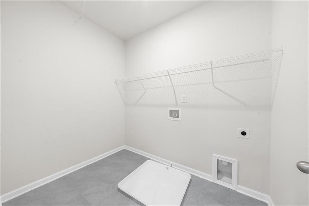 8620 Standing Stone Ball Ground, GA 30107 - Photo 42 of 61 a view of a room with racks on the wall