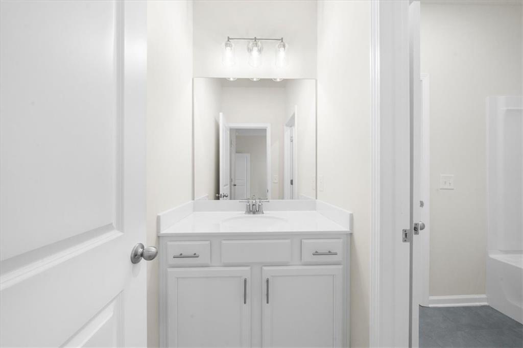 8620 Standing Stone Ball Ground, GA 30107 - Photo 45 of 61 a sink with a mirror