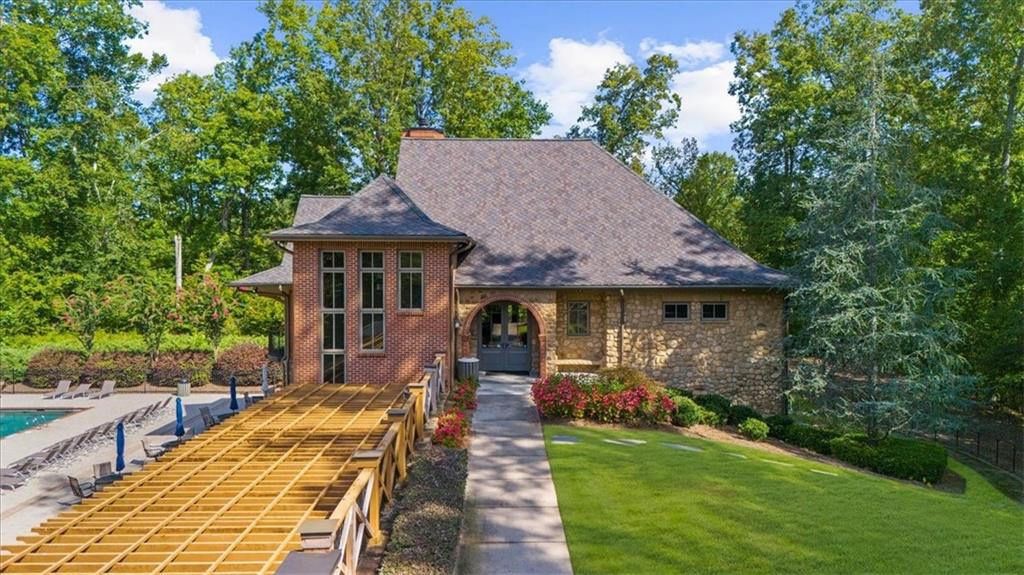 8620 Standing Stone Ball Ground, GA 30107 - Photo 56 of 61 a front view of a house with a yard