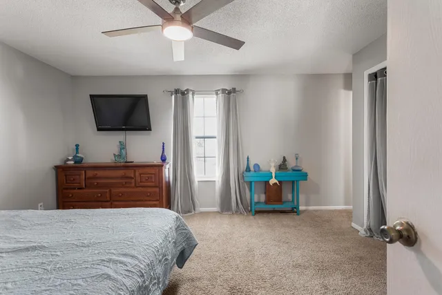 a kitchen with stainless steel appliances granite countertop a refrigerator a stove and a refrigerator