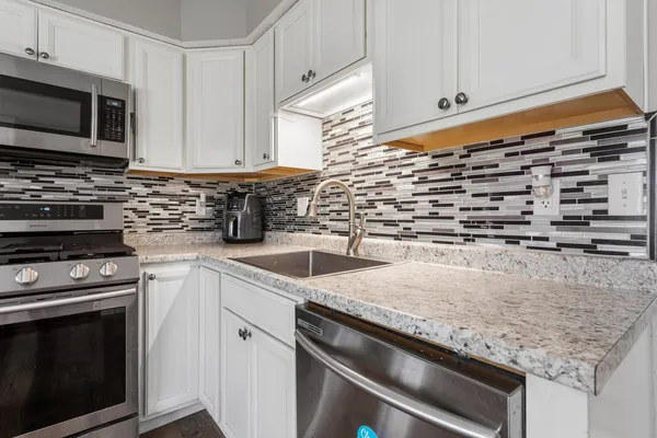 a kitchen with a stove microwave and refrigerator
