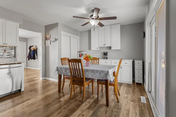 a dining room with furniture and window