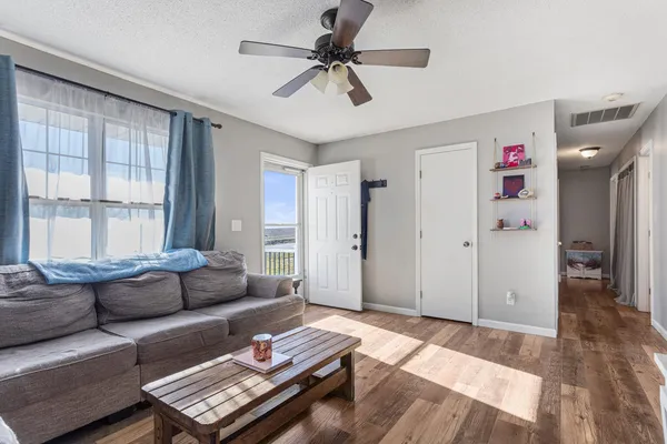a living room with furniture and a window