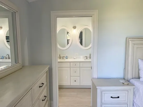 a bathroom with a sink vanity and mirror
