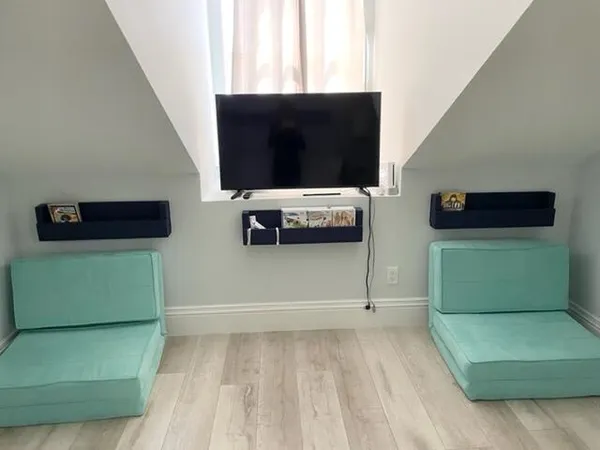 a living room with a flat screen tv and a fireplace