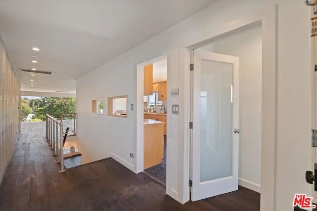 a view of entryway with wooden floor