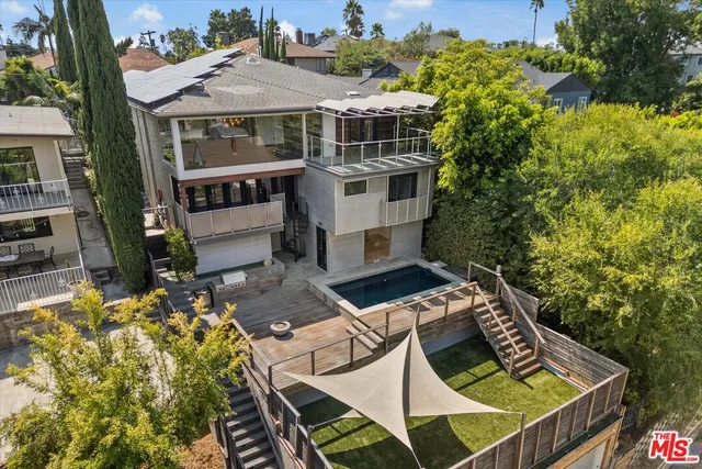 an aerial view of a house with swimming pool