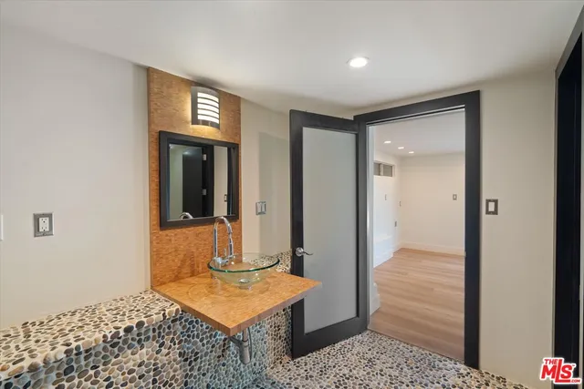 a bedroom with a bed and a table