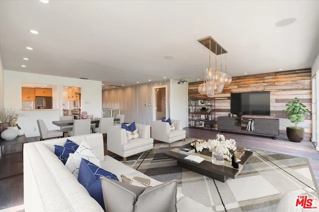 a living room with furniture fireplace and a flat screen tv