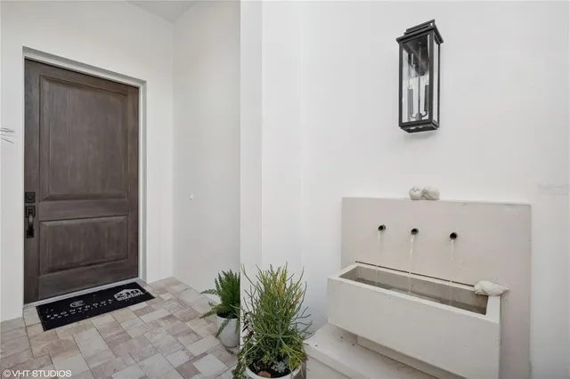 a view of potted plant in front of a door