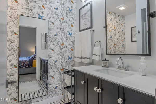 a bathroom with a sink and a mirror