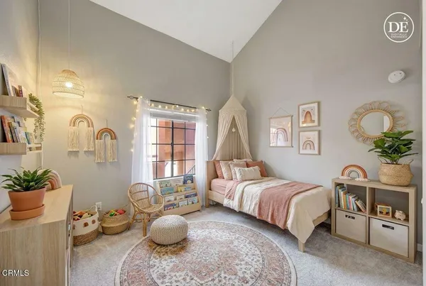 a bedroom with a bed and a couch
