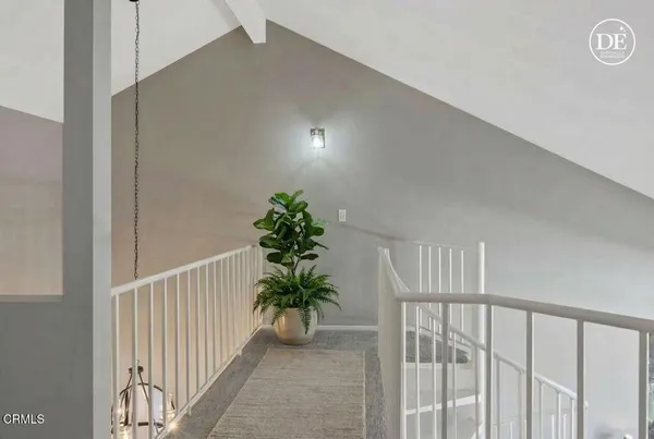 a view of a hallway with flower pot