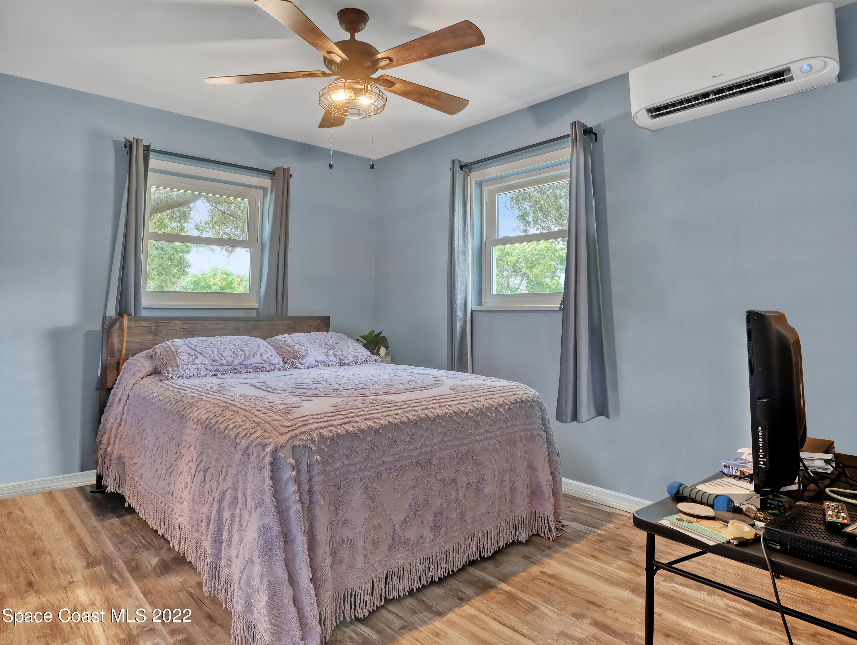 2156 King Richard Road Melbourne, FL 32935 - Photo 16 of 28 a bedroom with a bed tv and a window
