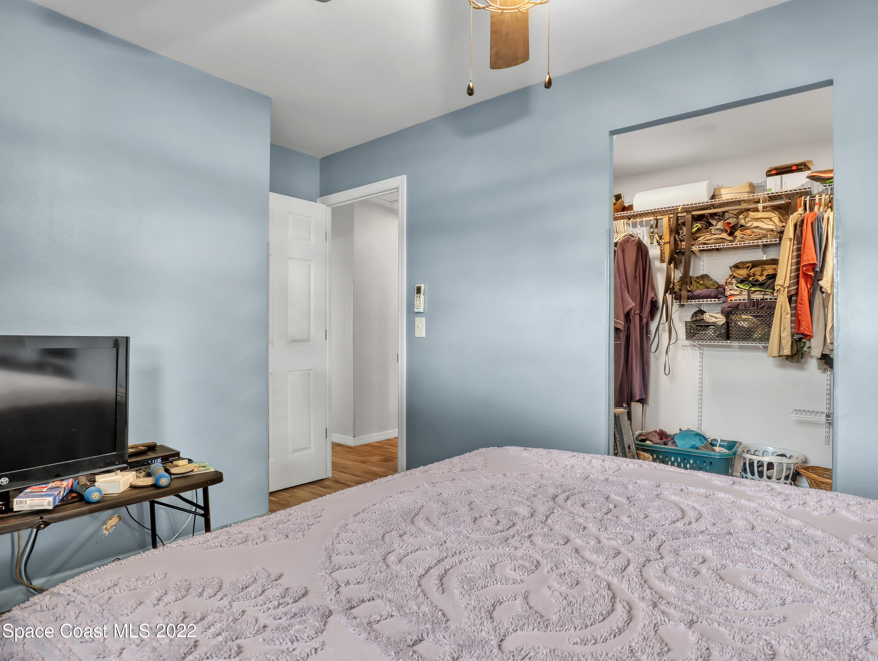 2156 King Richard Road Melbourne, FL 32935 - Photo 17 of 28 a bedroom with bed and a flat tv screen