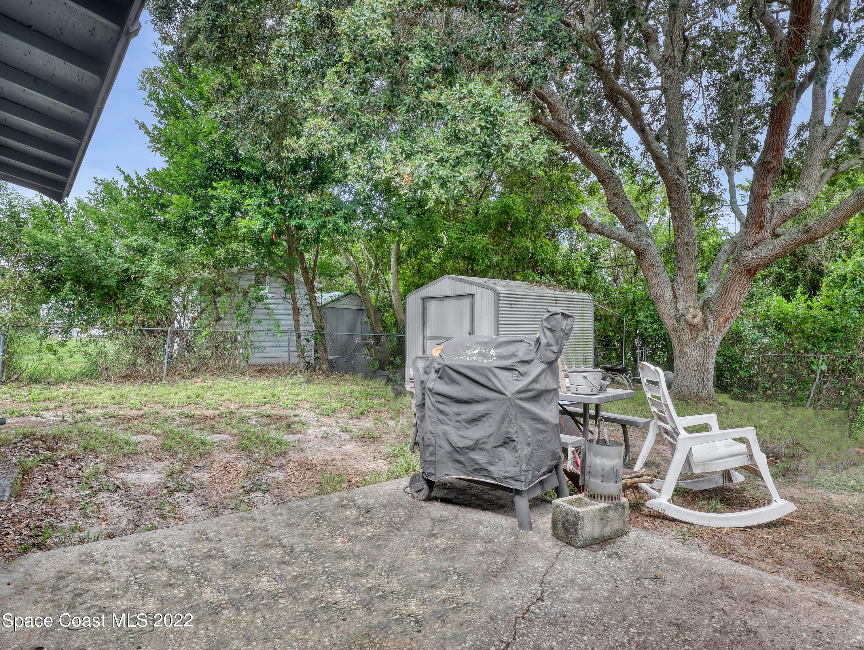 2156 King Richard Road Melbourne, FL 32935 - Photo 22 of 28 a view of a chairs in backyard of the house