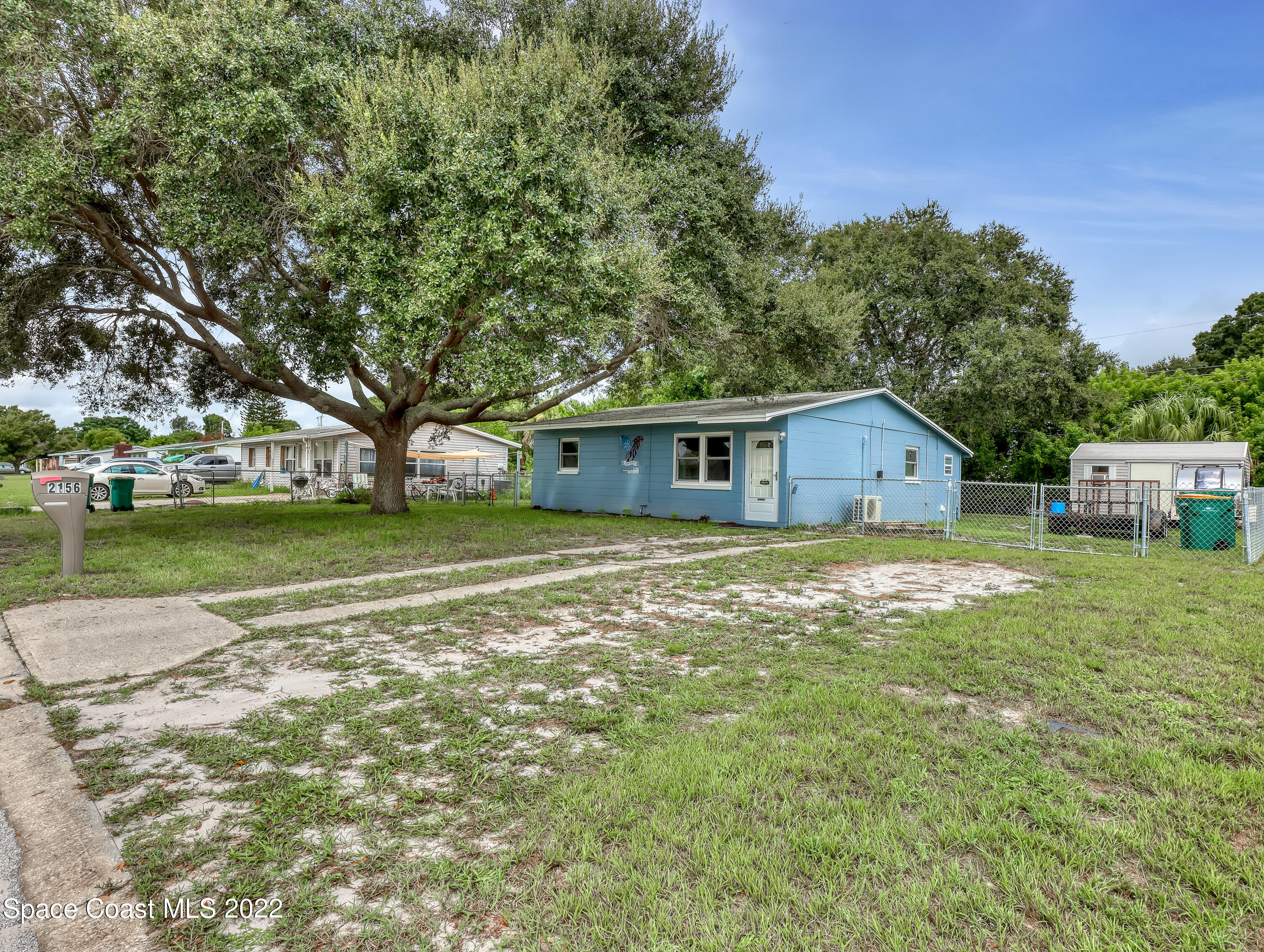 2156 King Richard Road Melbourne, FL 32935 - Photo 3 of 28 a front view of house with yard and green space