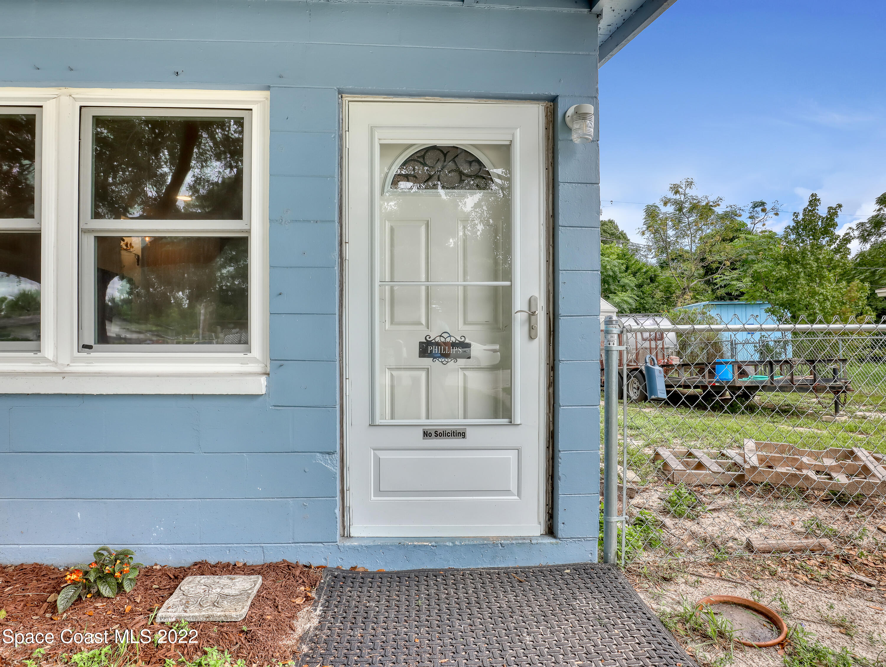 2156 King Richard Road Melbourne, FL 32935 - Photo 4 of 28 a front view of a house with a yard