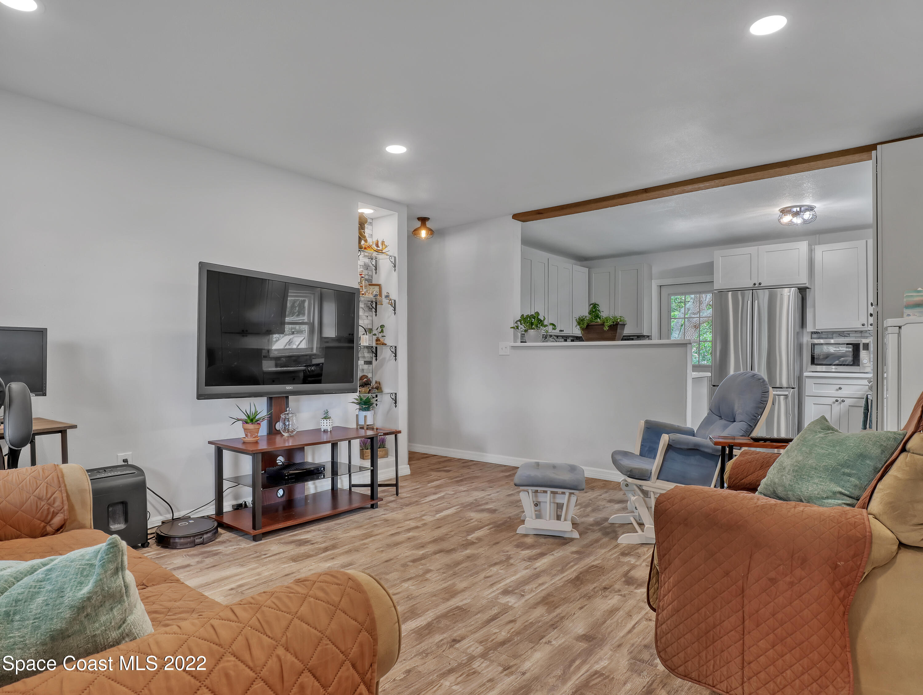 2156 King Richard Road Melbourne, FL 32935 - Photo 6 of 28 a living room with furniture and a flat screen tv