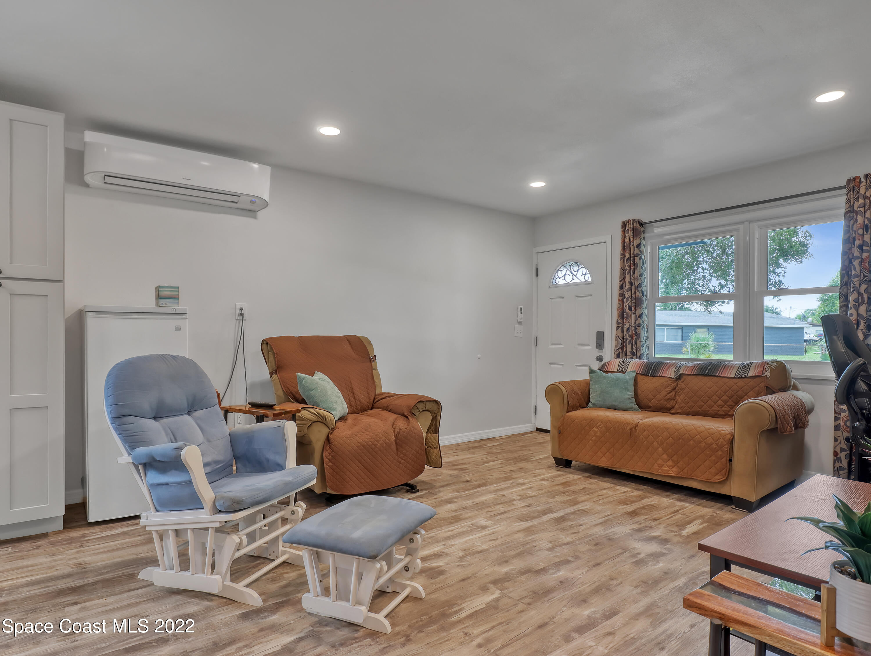 2156 King Richard Road Melbourne, FL 32935 - Photo 7 of 28 a living room with furniture and a large window