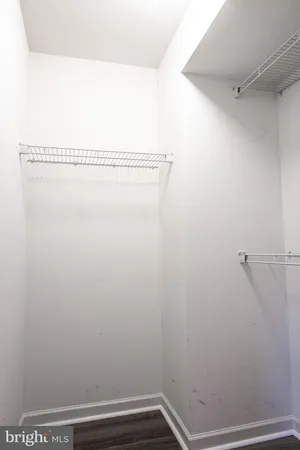 a view of small space with empty racks on the wall