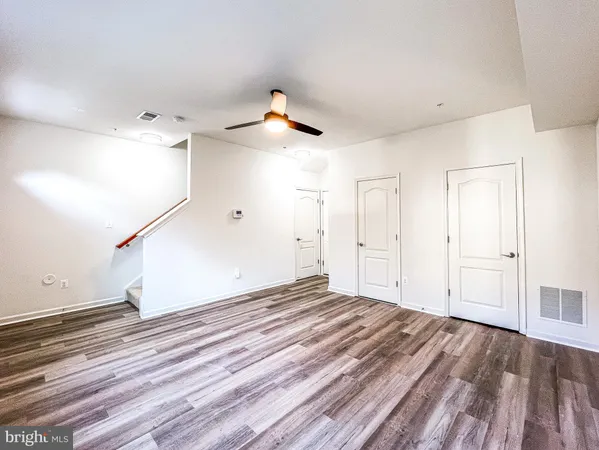 a view of a livingroom with wooden floor