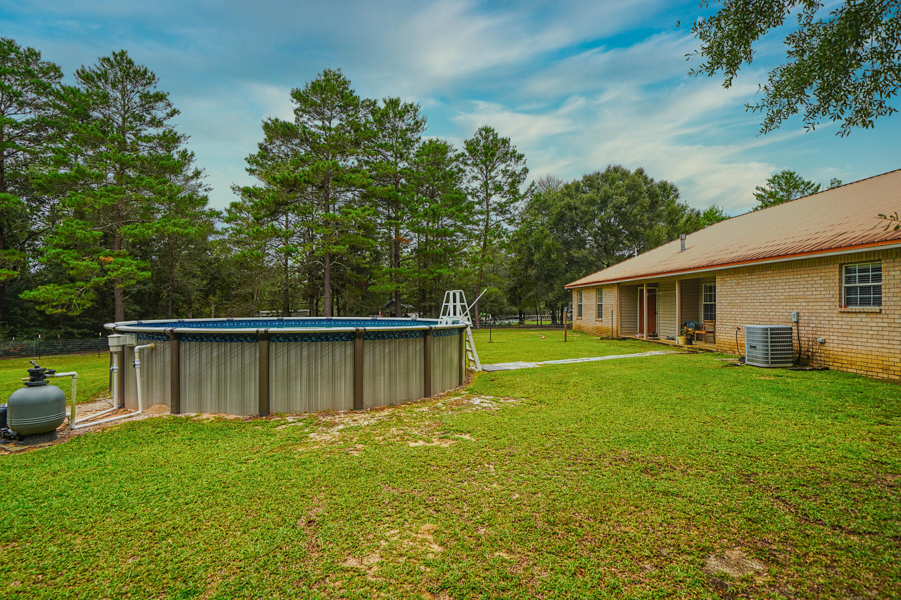 695 7 Oaks Road DeFuniak Springs, FL 32433 - Photo 44 of 47 a view of a house with a backyard