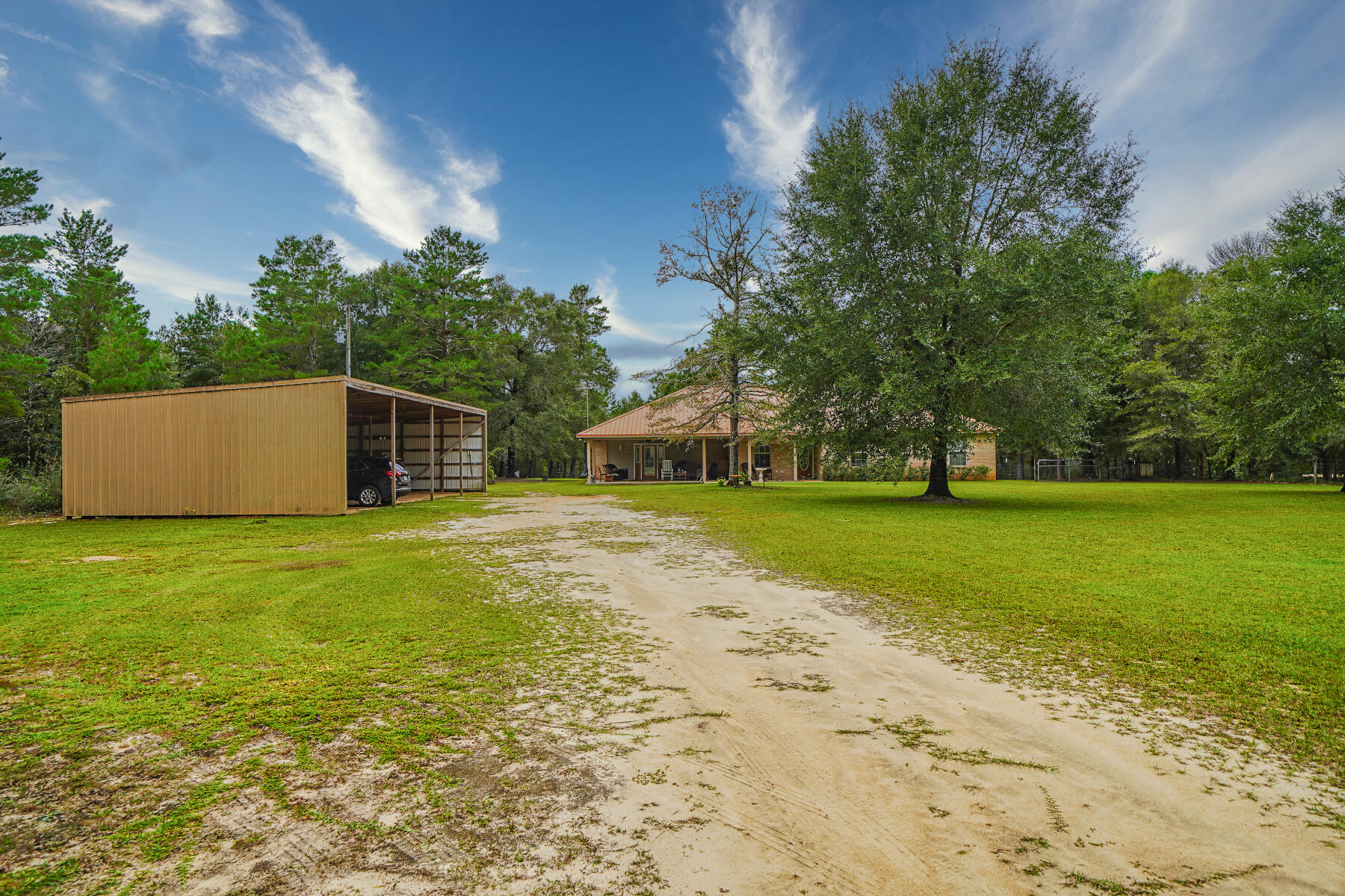 695 7 Oaks Road DeFuniak Springs, FL 32433 - Photo 46 of 47 a view of a house with a yard